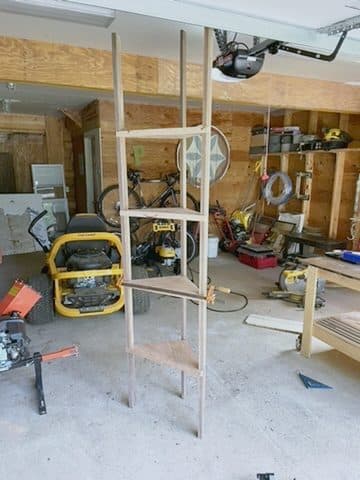 Tall ladder-shelf frame in doorway