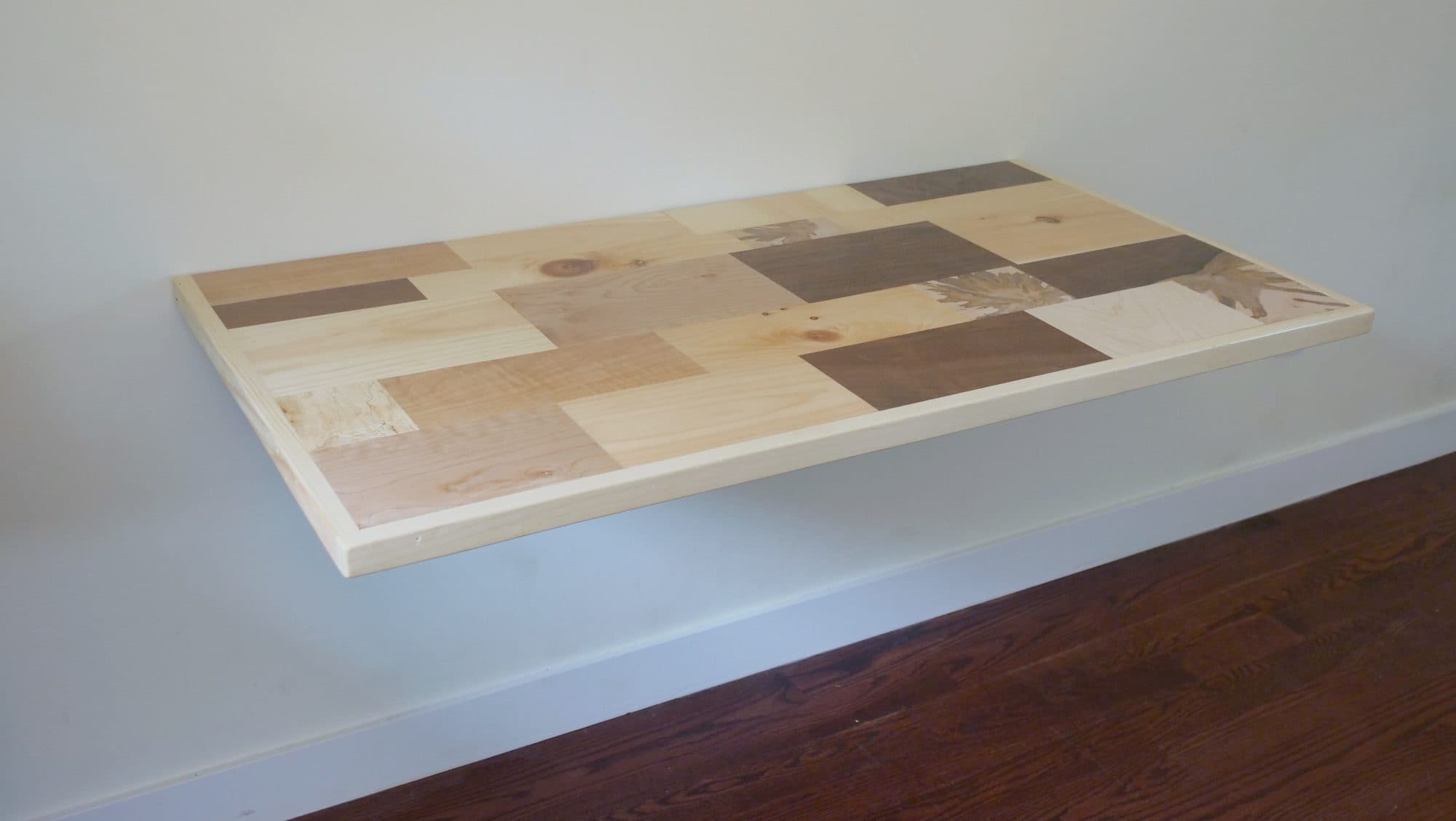 Fold-up wall-mounted desk, patchwork hardwood top