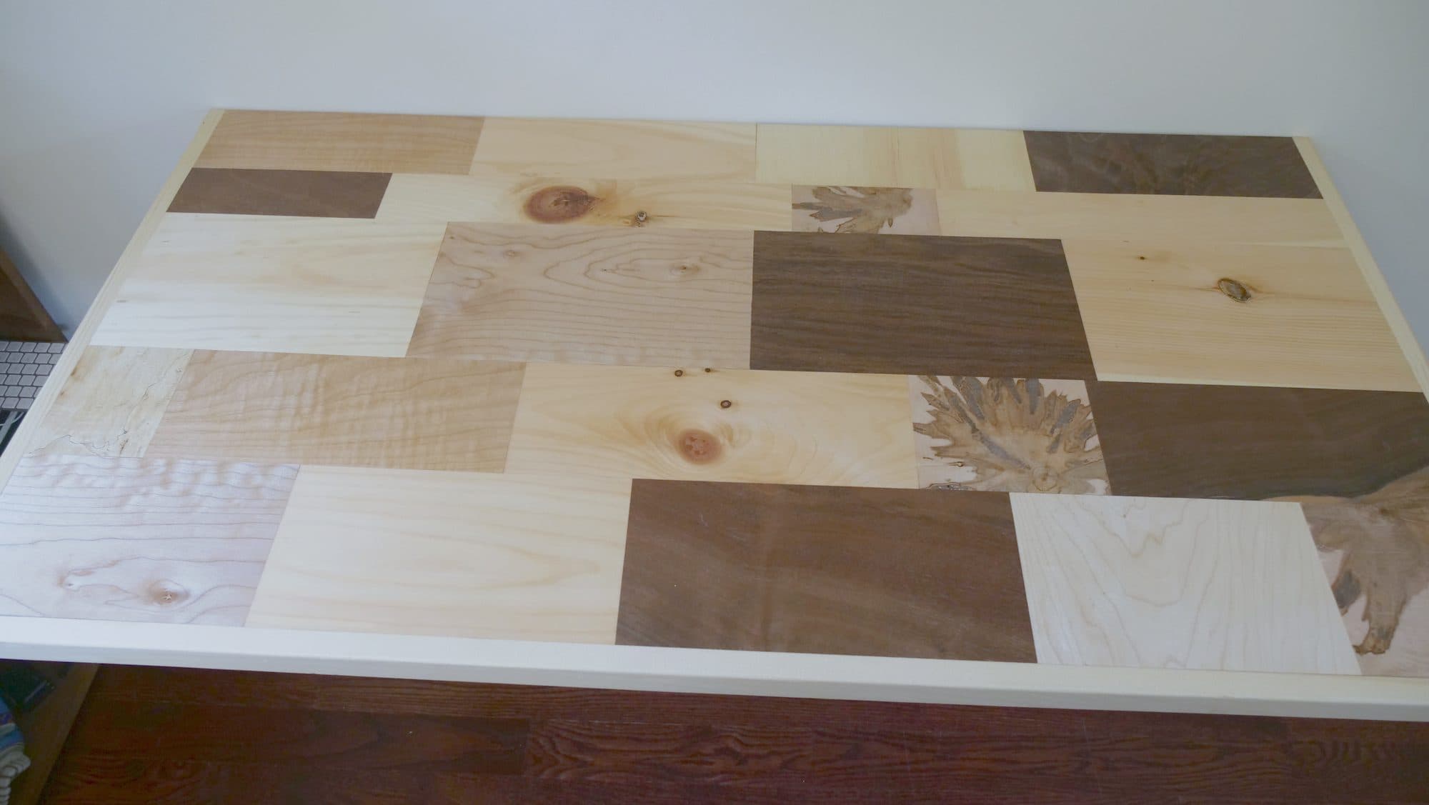 Fold-up wall-mounted desk, patchwork hardwood top