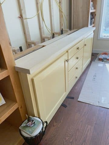 Built-in credenza, cream w/ wood top