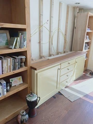 Cream credenza + wood top + bookshelf, styled