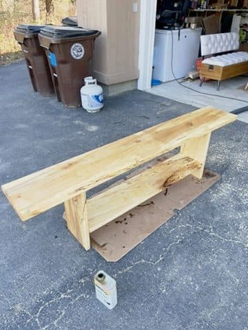 Live-edge slab bench, raw, driveway