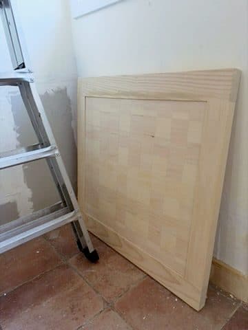 Framed light chessboard, leaning