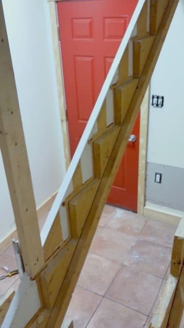 Stringer framing at red door, no treads